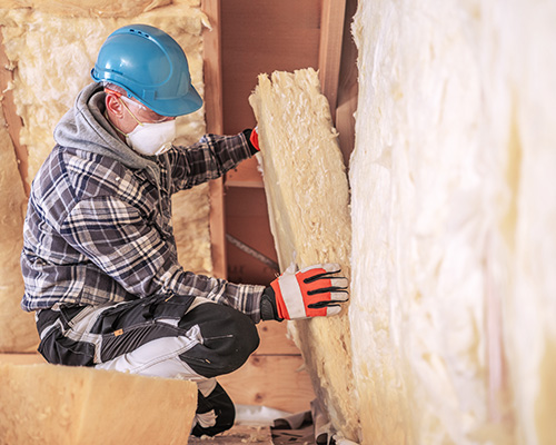 rigid-insulation2-hanover-pa Technician installing rigid foam insulation in attic.